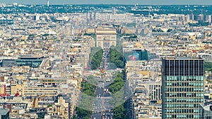 Aerial view of Paris and The Arc de Triomphe with Champs Elysees timelapse from the top of the skyscrapers in Paris