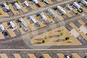 An aerial view of a park where recreational vehicles are parked and RVs are on vacation