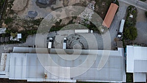 Aerial view of parked trailer truck loading parcel boxes at warehouse. Industry Freight Truck Transportation. Shipping Warehousing