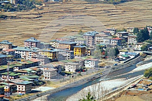 Aerial view of Paro City with colorful houses landscape near a r