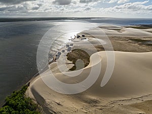 Aerial view of Parque da Dunas - Ilha das Canarias, Brazil. Huts and boats and sand dunes.