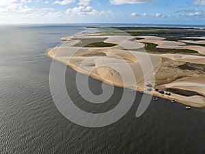 Aerial view of Parque da Dunas - Ilha das Canarias, Brazil. Huts and boats and sand dunes.