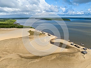 Aerial view of Parque da Dunas - Ilha das Canarias, Brazil. Huts and boats and sand dunes.