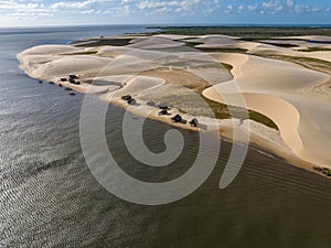 Aerial view of Parque da Dunas - Ilha das Canarias, Brazil. Huts and boats and sand dunes.