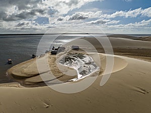 Aerial view of Parque da Dunas - Ilha das Canarias, Brazil. Huts and boats and sand dunes.