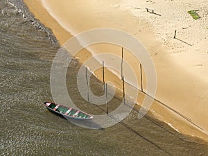 Aerial view of Parque da Dunas - Ilha das Canarias, Brazil. Huts and boats and sand dunes.