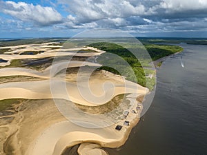 Aerial view of Parque da Dunas - Ilha das Canarias, Brazil. Huts and boats and sand dunes.