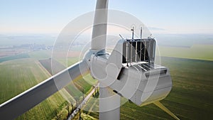 Aerial view of part of windmill turbine in countryside, Green energy