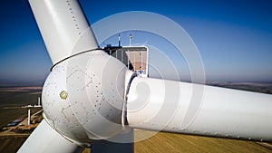 Aerial view of part of windmill turbine in countryside, Green energy