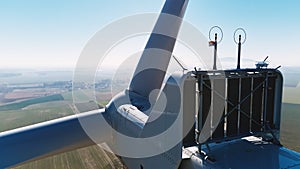 Aerial view of part of windmill turbine in countryside, Green energy