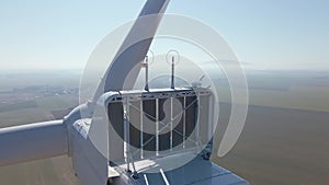 Aerial view of part of windmill turbine in countryside, Green energy