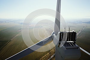 Aerial view of part of windmill turbine in countryside, Green energy