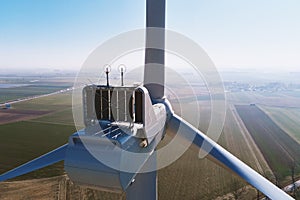 Aerial view of part of windmill turbine in countryside, Green energy