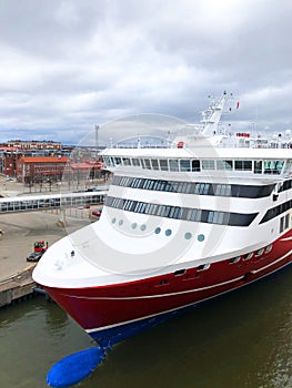 Aerial view of a passengAerial view of a passenger ship in alongside the terminal of port.er ship in alongside the terminal of por