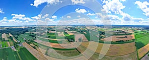 Aerial view of pastures and farmlands Beautiful French countryside with green fields and meadows. Rural landscape on sunset