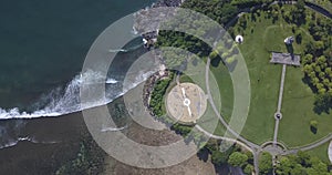 Aerial view of path and buildings at ocean coastline