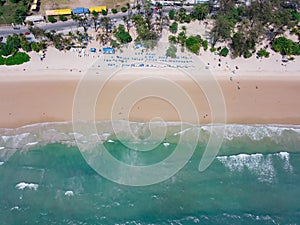 Aerial view of Patong beach, Phuket island and sea in summer, and urban city with blue sky for travel background, Andaman ocean,