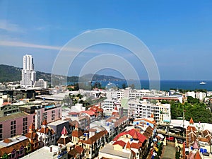 Aerial view of Patong beach, Phuket island and sea, urban city with blue sky. Andaman sea, Thailand