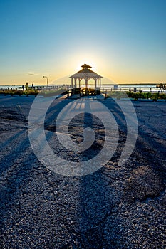 Aerial view of pavilion in beach during sunset