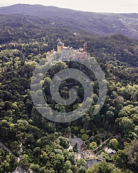 Aerial view of Pena Palace, a hilltop Romanticist palace in parkland at sunset, Sintra, Lisbon, Portugal