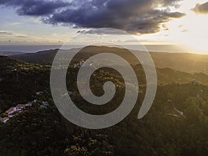 Aerial view of Pena Palace in Sintra, a Romanticist castle on hilltop surrounded by forest during a beautiful sunset, Sintra, photo