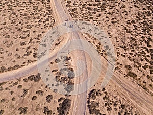 Aerial view of people cycling on a dirt path in the island of La Graciosa, Lanzarote, Canary Islands. Spain.