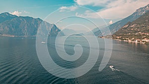 Aerial view of people Jetskiing And Boating In The Calm Waters Of Lake Garda In Italy photo