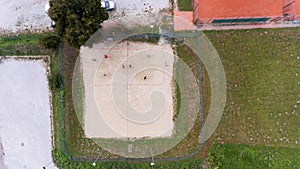 Aerial view of people playing beach volleyball.