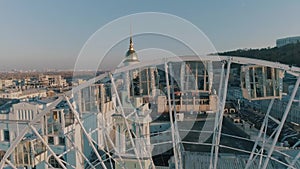 Aerial view of people sitting in the ferris wheel