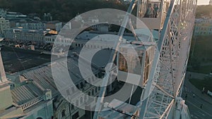 Aerial view of people sitting in the ferris wheel