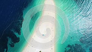 Aerial view of people sunbathing on Zlatni Rat, on the island of Brac, Croatia