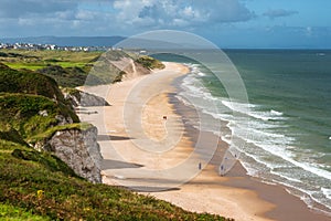 Aerial view of people walking on Whiterocks Beach photo