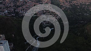 Aerial view of the Petare slum in the city of Caracas, Venezuela, at sunset. Bird eye view of a slum in a big city in South