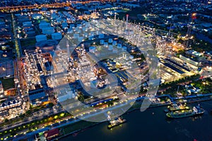 Aerial view of petrochemical oil refinery and sea in industrial engineering concept in Bangna district at night, Bangkok City,