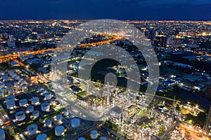 Aerial view of petrochemical oil refinery and sea in industrial engineering concept in Bangna district at night, Bangkok City,