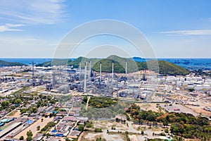 Aerial view of petrochemical oil refinery and sea in industrial engineering concept in Laem Chabang, Chonburi province, Thailand.