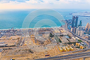 Aerial view of petrochemical oil refinery and sea in industrial engineering and energy concept in Dubai, urban city, UAE. Oil and