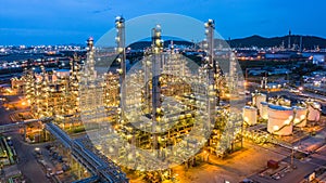 Aerial view petrochemical plant and oil refinery plant background at night,  Petrochemical oil refinery factory plant at night