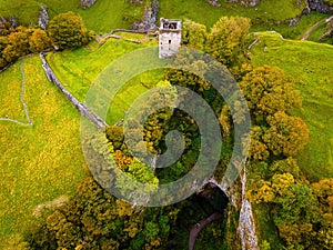 Aerial view of Peveril Castle ruins in Castleton in Peak District, England