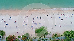Aerial view of Phuket sea and sand beach in summer season Amazing sea beach with ocean wave foams. Beautiful top view of beautiful