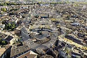 Aerial view of Piazza dell`Anfiteatro, a medieval square with cafÃ¨ and market in Lucca old town, Tuscany, Italy