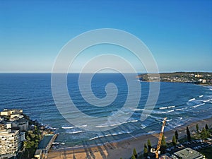 Aerial view of a picturesque residential neighborhood nestled alongside a serene body of water