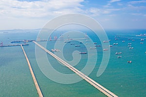 Aerial view of pier with boats with container cargo ship in the export and import business and logistics international goods in