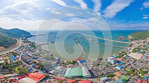 Aerial view of pier with boats with container cargo ship in the export and import business and logistics international goods in