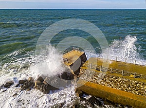 Aerial view of a pier with rocks. Pizzo Calabro pier, panoramic view from above. Broken pier, force of the sea. Power of Waves. N