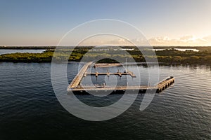 Aerial view of a pier surrounded by waters in North Palm Beach, Florida