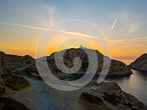 Aerial view of the Pietra Lighthouse at sunset. Red Island, Corsica, France