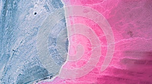 Aerial view of pink salt lake. Salt production plants evaporated brine pond in a salt lake.