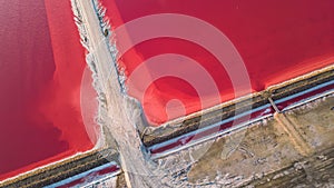 Aerial view of pink salt lake. Salt production plants evaporated brine pond in a salt lake.