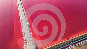 Aerial view of pink salt lake. Salt production plants evaporated brine pond in a salt lake.